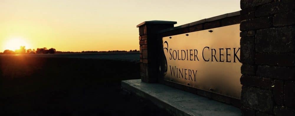 Soldier Creek Winery entrance sign at sunset with warm golden light