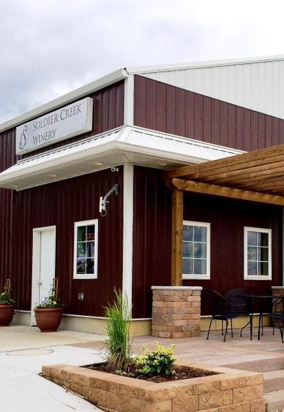 Exterior of the Soldier Creek Winery building with entry overhang and door