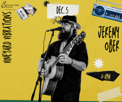 “Graphic for Vineyard Vibrations live music featuring Jeremy Ober at Soldier Creek Winery on December 5, 6–8PM. Jeremy is shown in black and white playing guitar and singing into a microphone. Yellow background with cassette and radio illustrations.”