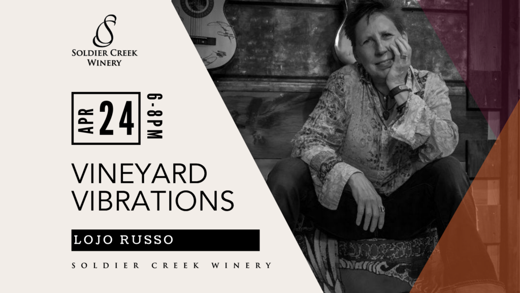 Vineyard Vibrations live music event at Soldier Creek Winery featuring Lojo Russo on April 24, 6–8pm. Black-and-white photo shows a woman seated casually with a guitar visible in the background.